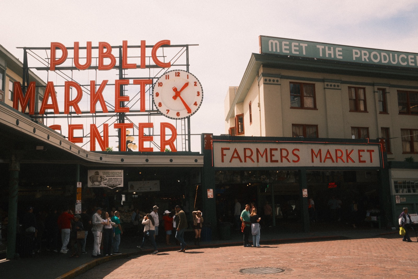 The iconic Public Market Center sign and clock at the entrance to Pike Place Market